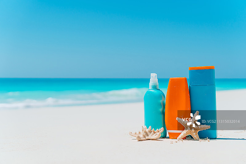 沙滩上的防晒霜、太阳镜和海星图片素材