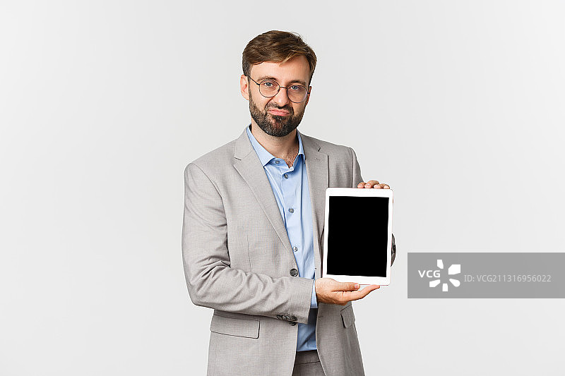 商务男士手持平板电脑图片素材