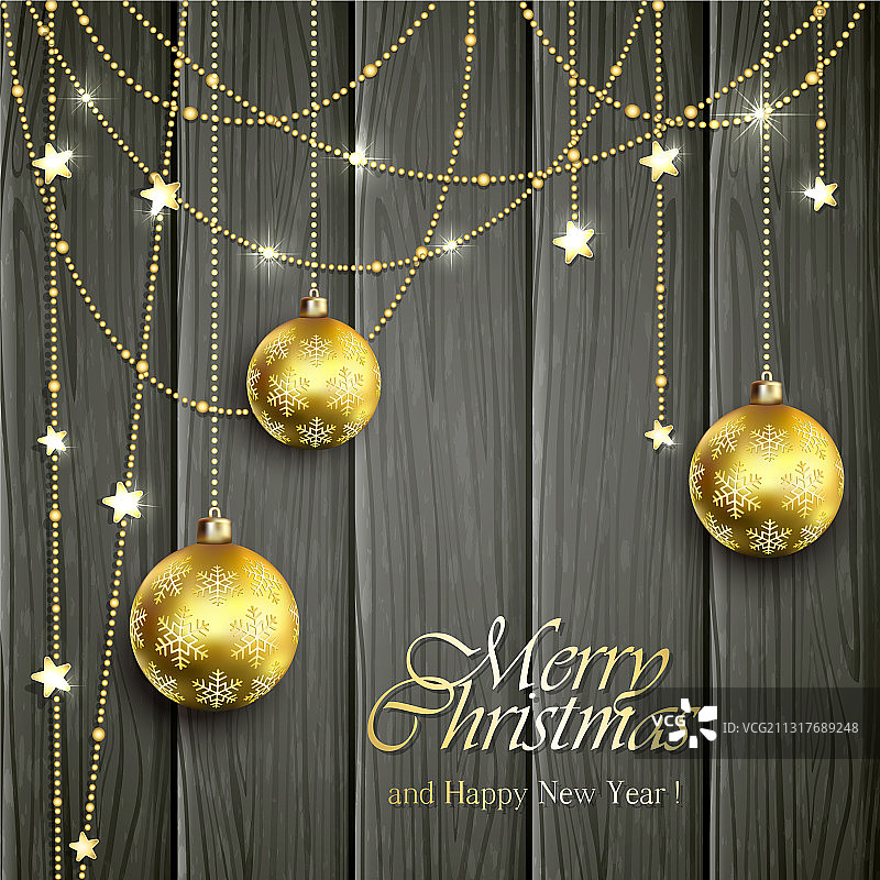 黑色木质背景上的金色圣诞球图片素材