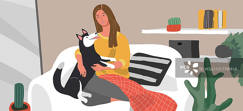 女孩与哈士奇在沙发上休息图片素材