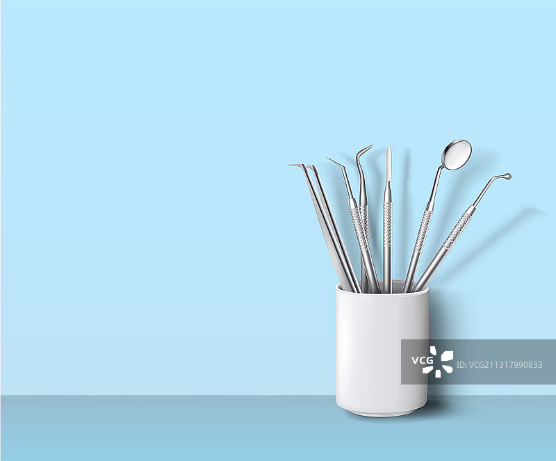 陶瓷杯中的牙科器械图片素材