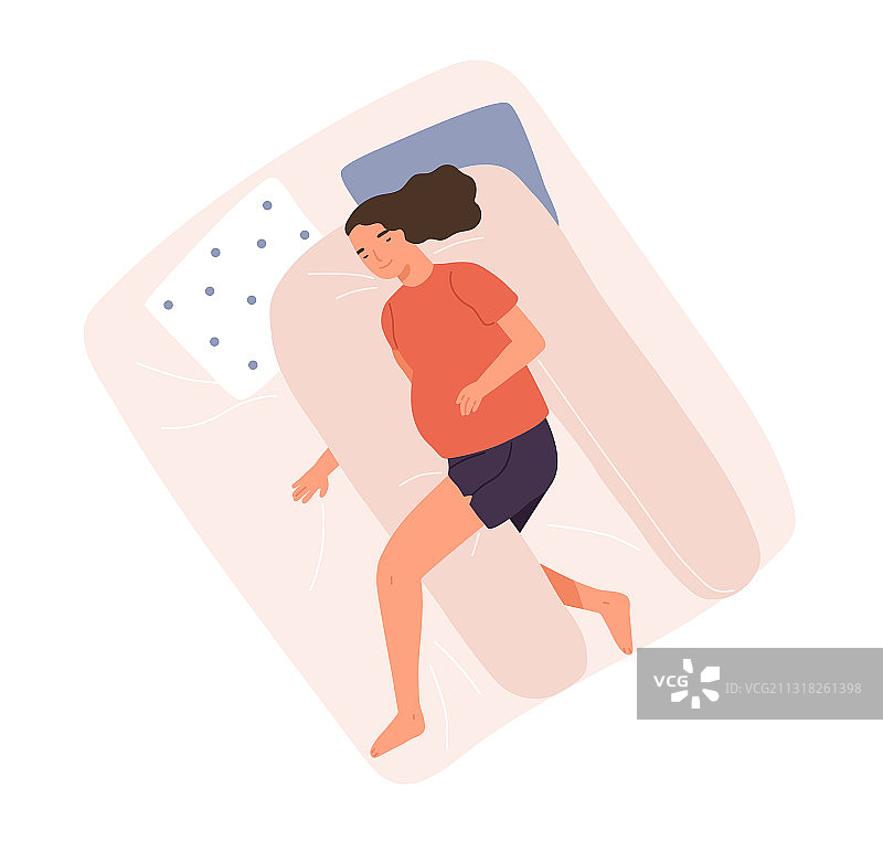挺着大肚子在枕头上睡觉的开心女人图片素材