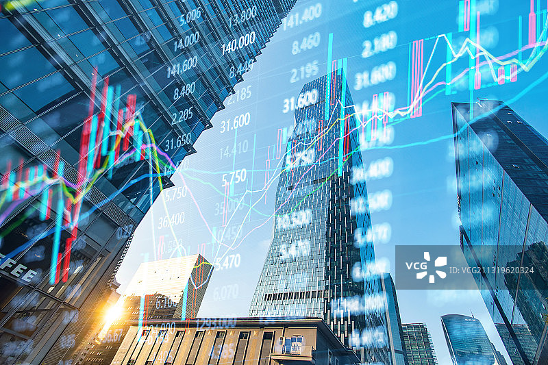 低角度仰视现代商业建筑和金融股市证券走势概念图片素材