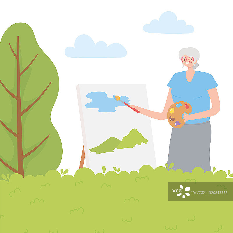 老年妇女用画笔绘画的活动图片素材