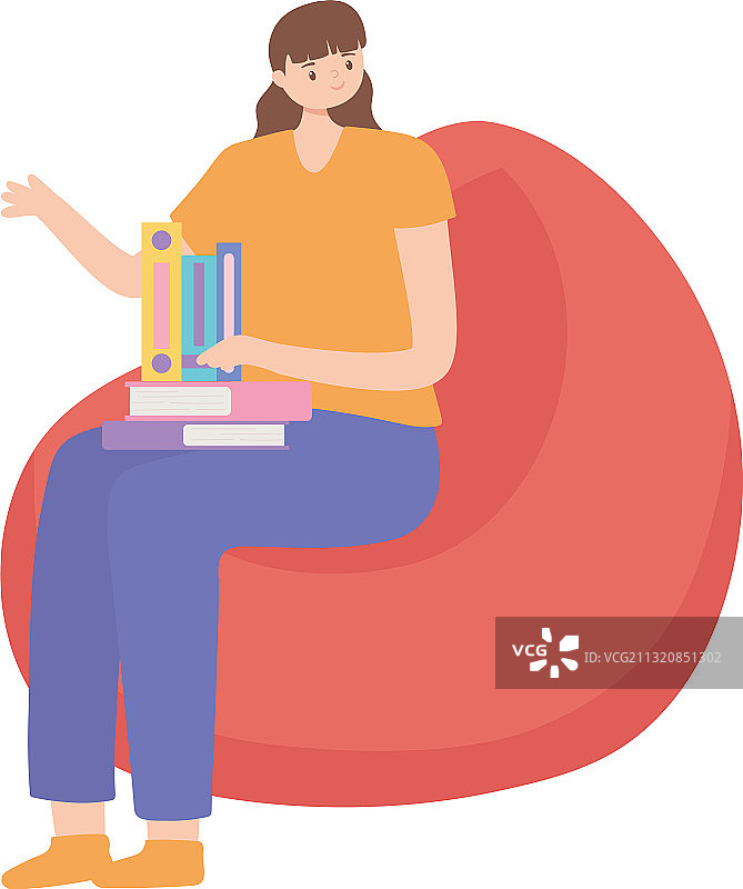 坐在豆袋椅上看书的年轻女人图片素材