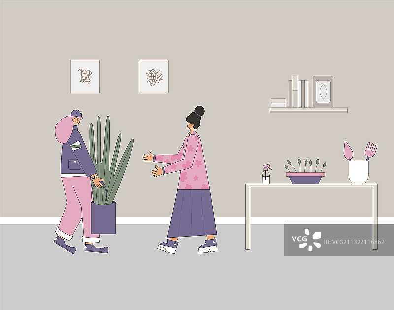 手捧室内盆栽的男人图片素材