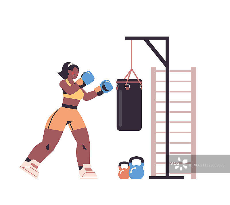 女拳击手用沙袋做练习图片素材