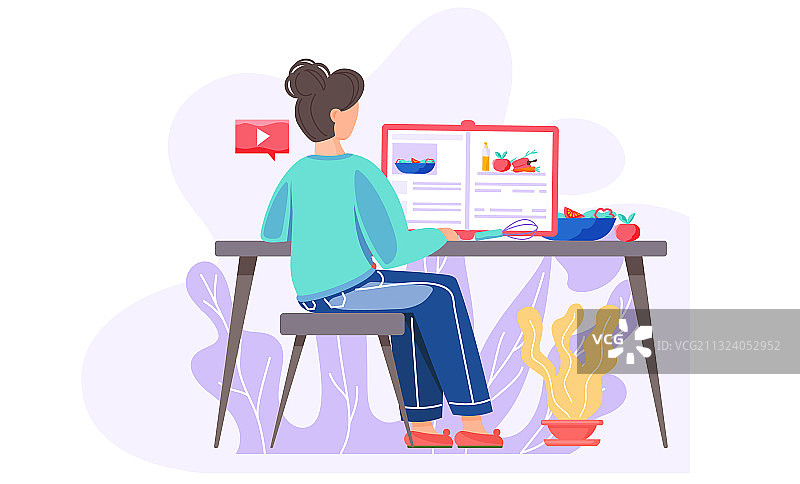 女孩坐在桌旁看食谱图片素材