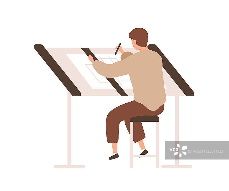 建筑师设计师坐在桌子前画画图片素材