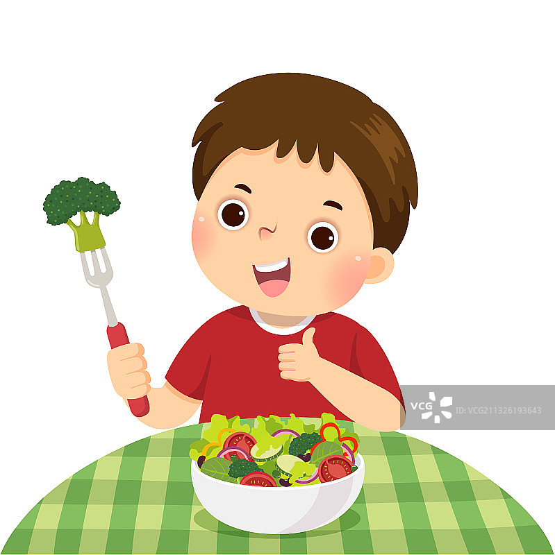 男孩吃新鲜蔬菜沙拉图片素材