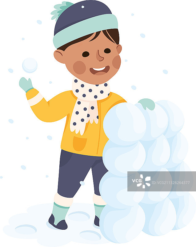 用雪球建造雪塔的快乐男孩图片素材