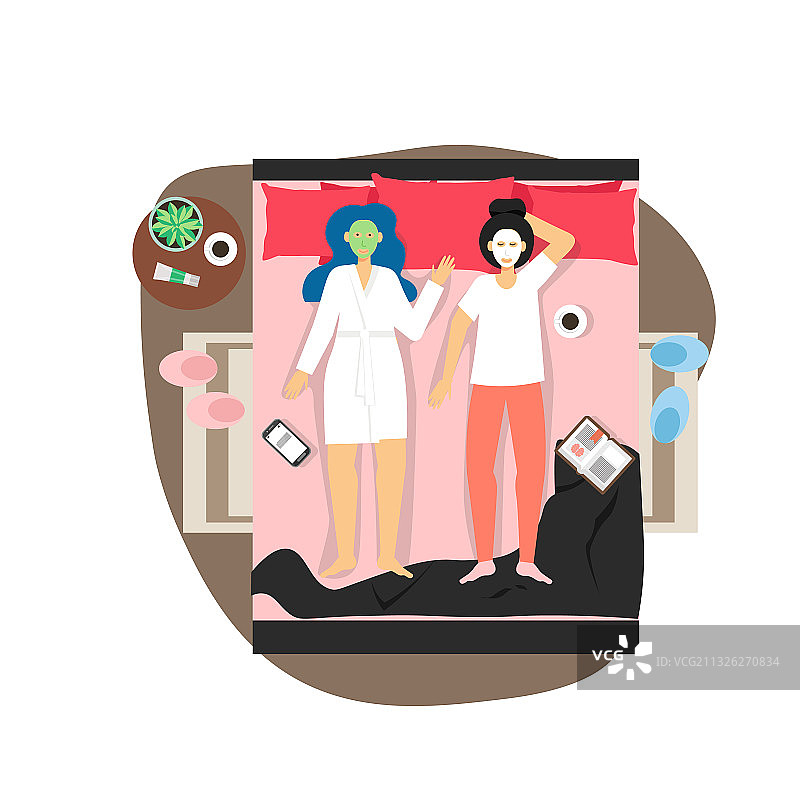 两个快乐的女孩在床上做美容护理图片素材