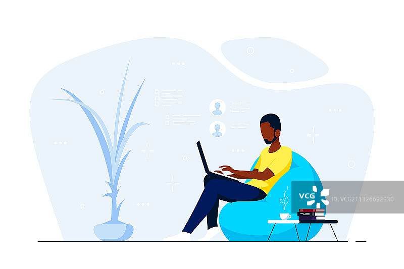 在家坐在懒人沙发上的年轻黑人男子图片素材