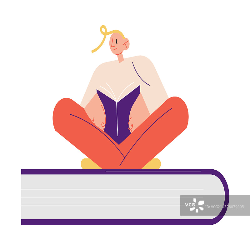 快乐的年轻男孩坐在大书上阅读图片素材
