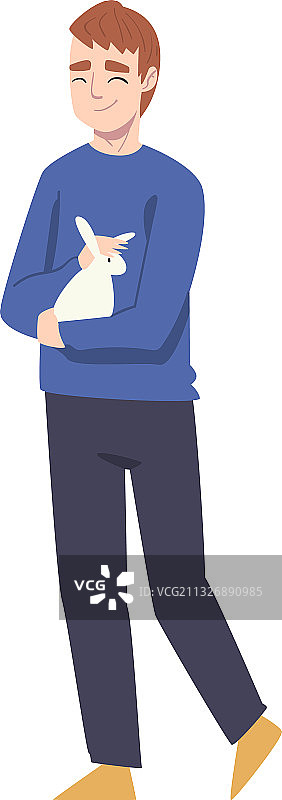 抱着小白兔的快乐复活节青少年男孩图片素材