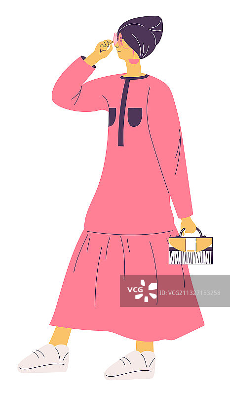 戴着头巾，身穿粉色长裙的年轻女人图片素材
