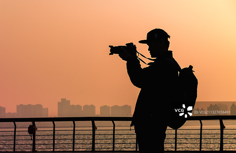 夕阳摄手图片素材