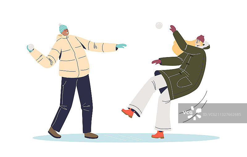 穿冬装的年轻人玩雪球图片素材