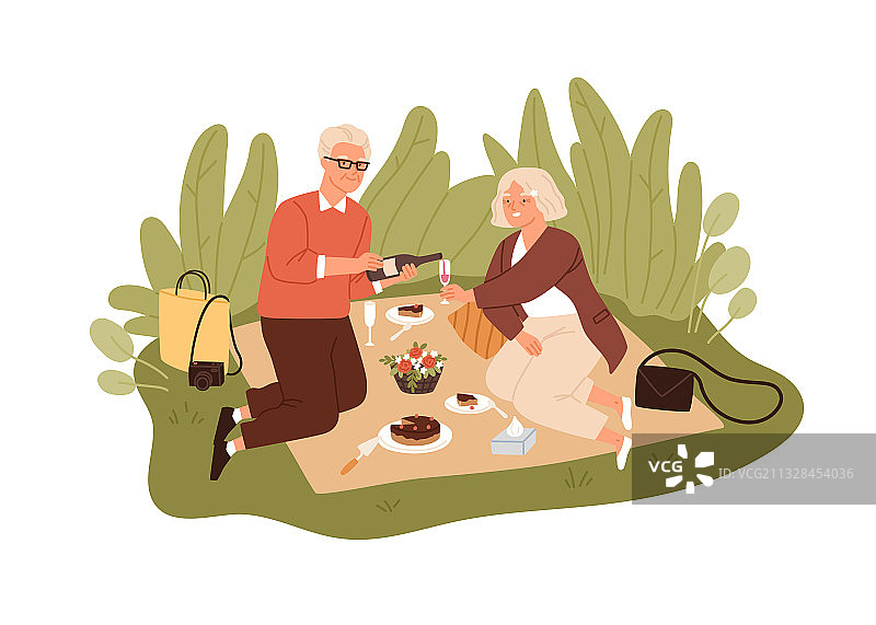 快乐的老年夫妇喝着葡萄酒庆祝图片素材