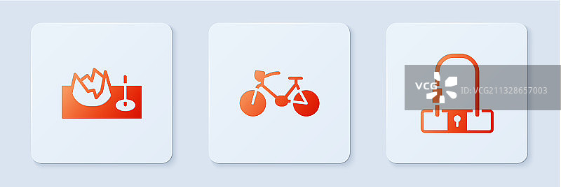 街道坡道上的自行车和白色方锁图片素材