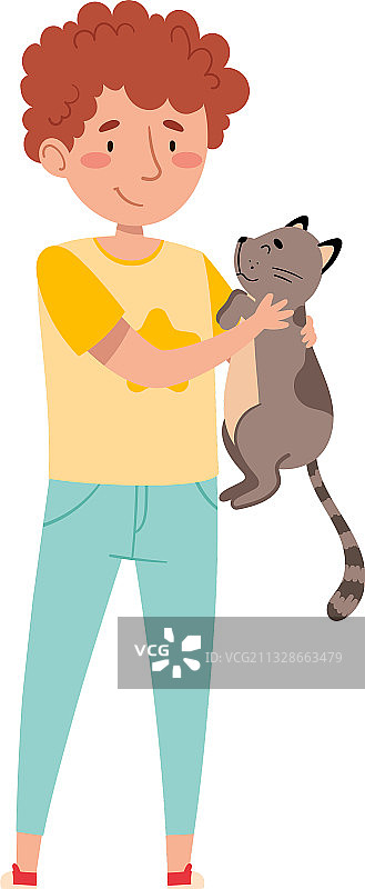 男孩抱着他的猫，爱抚它图片素材