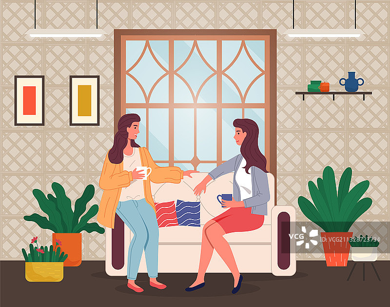 坐在客厅沙发上的两个年轻女孩图片素材