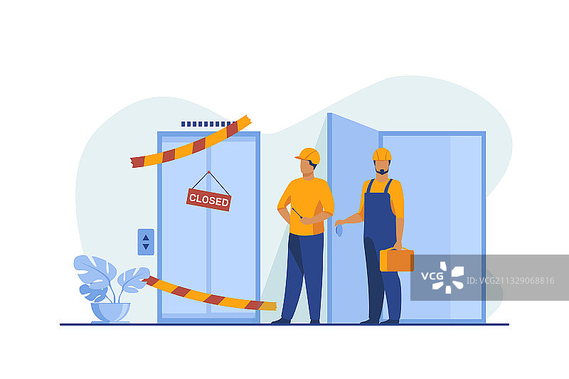 身穿工作服的工人在关闭的故障设备旁图片素材