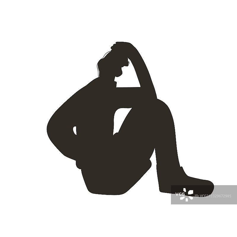 精神障碍年轻人坐在地板上图片素材