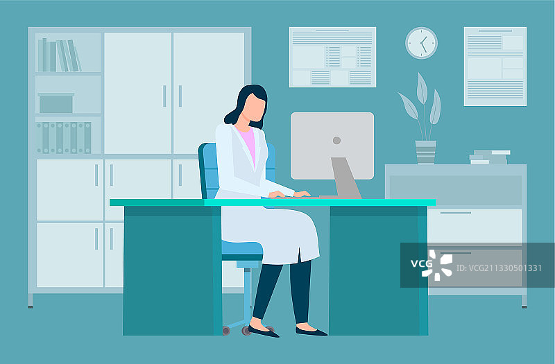 身穿医用外套的女人在笔记本电脑前工作图片素材