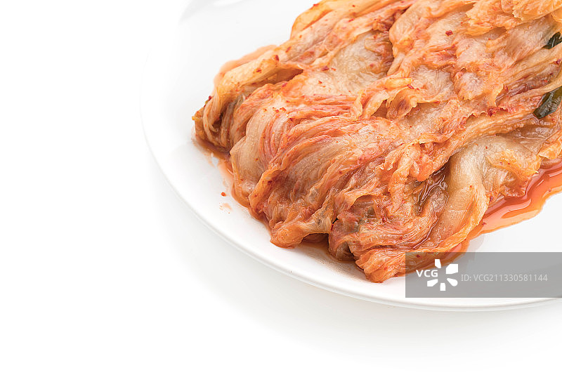 白色背景餐盘中的肉类特写图片素材