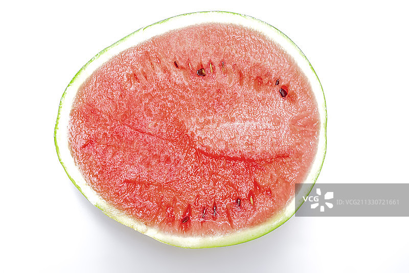 棚拍白色背景的有机新鲜西瓜图片素材