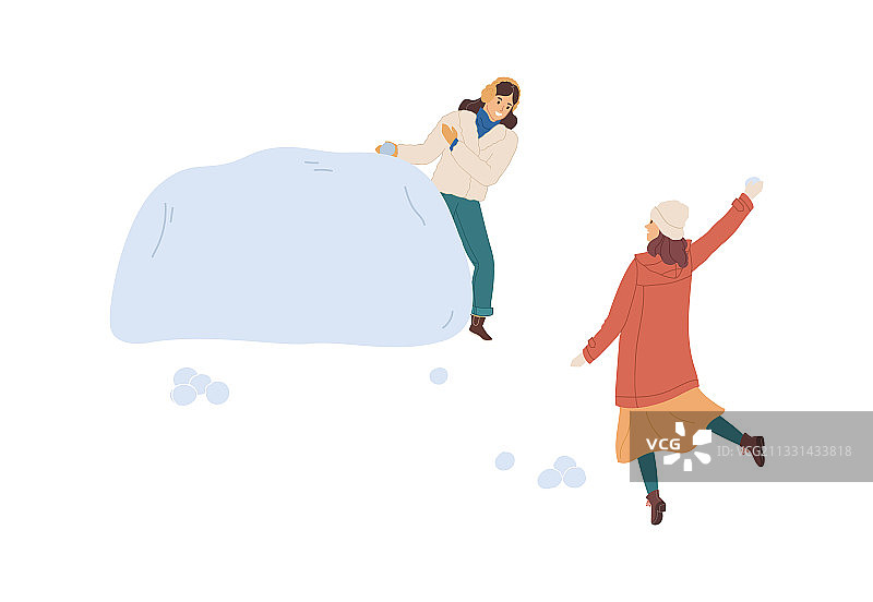 女性躲在雪堡或雪堆后面图片素材