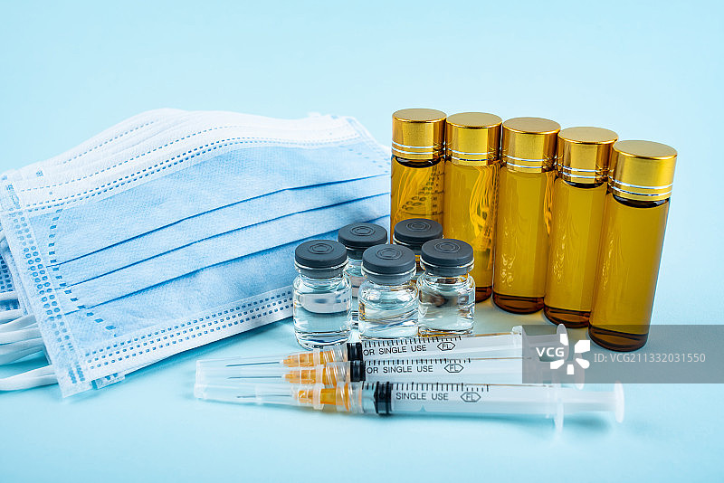 一次性医用口罩和疫苗图片素材