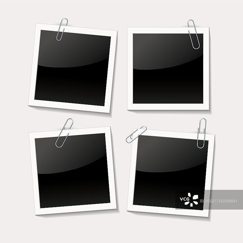 用回形针夹在白色背景上的照片图片素材