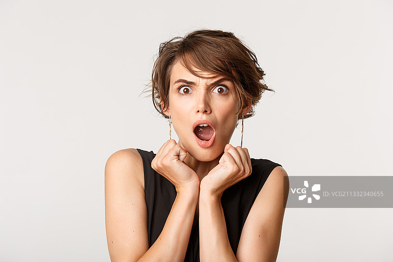 震惊的女人白色背景肖像图片素材