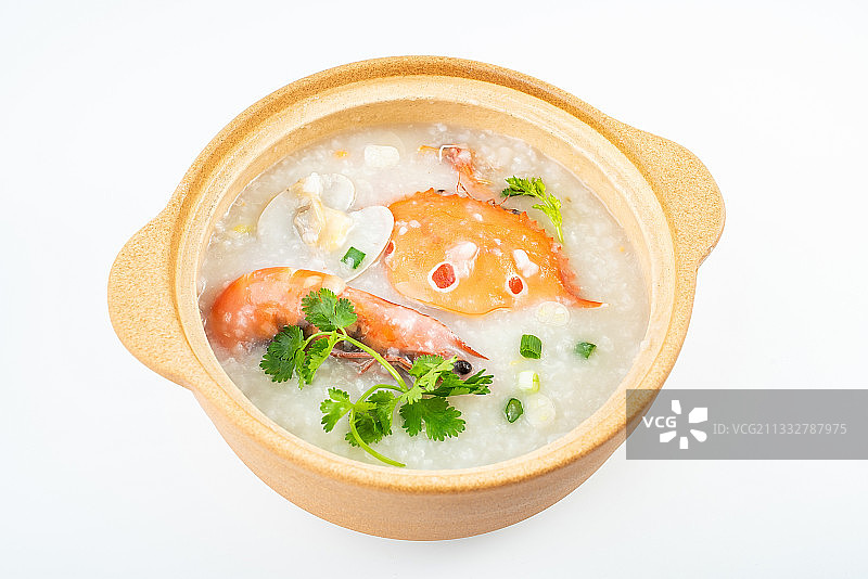 白背景上的一锅营养美味的螃蟹海鲜粥图片素材