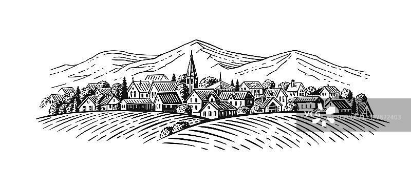 以山脉为背景的大型村庄和农田图片素材