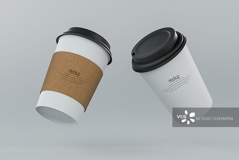 灰色背景上空中的两个一次性咖啡杯样机图片素材