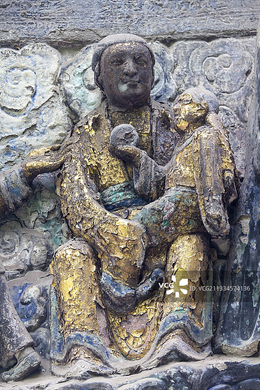 重庆大足石刻之宝顶山石刻：父母恩重经变相——咽苦吐苦恩图片素材