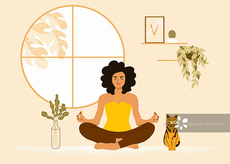 女孩与猫咪一起呈莲花坐姿图片素材