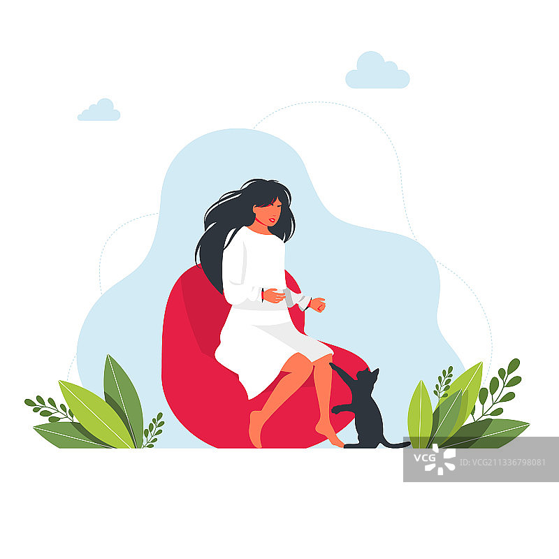 女孩坐在矮脚凳上，猫咪向她伸出手图片素材