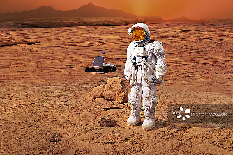 宇航员和火星车在火星上执行任务图片素材