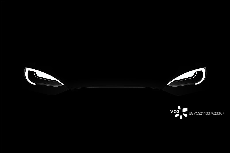 黑暗中黑色电动汽车的前大灯图片素材