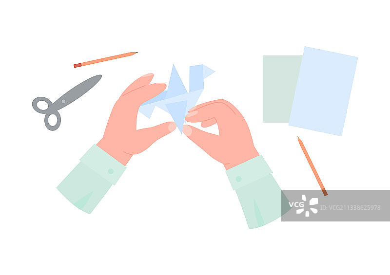 人手制作手工折纸的俯视图图片素材