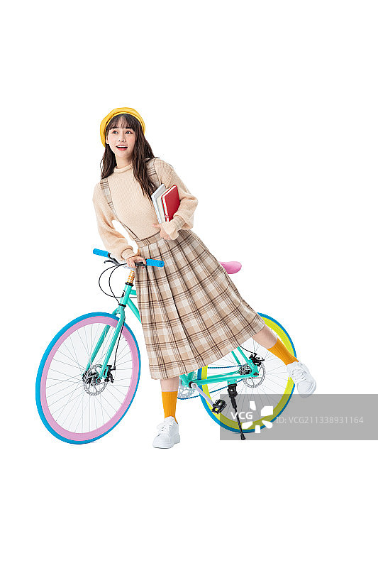 骑车的年轻女学生图片素材