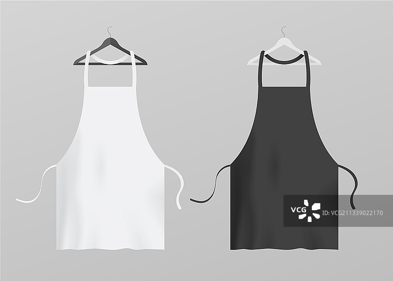 两个厨房围裙挂在衣架上图片素材