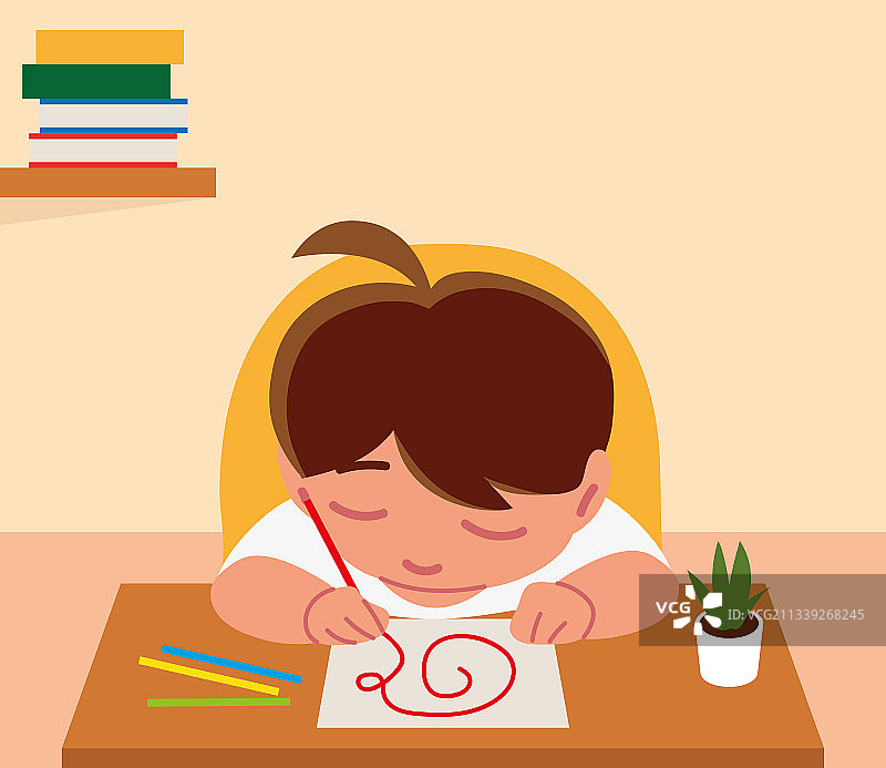 在桌前画画的男孩图片素材