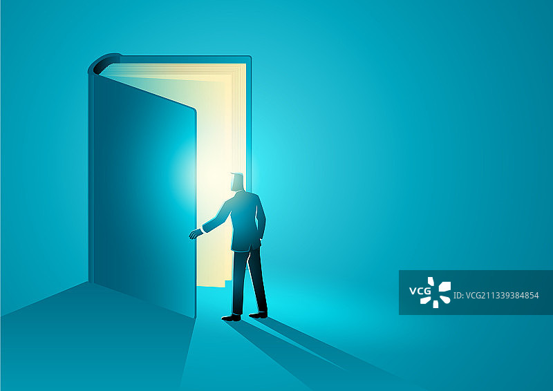 男子打开一本巨大的书图片素材