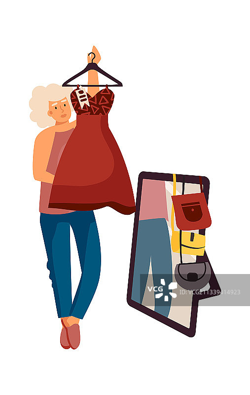 女人在服装店购物时选择连衣裙图片素材