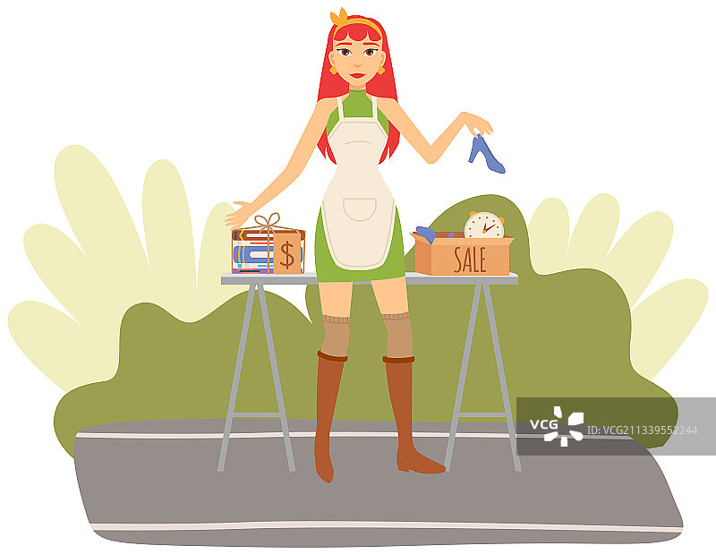 女孩在旧货出售活动中卖书图片素材